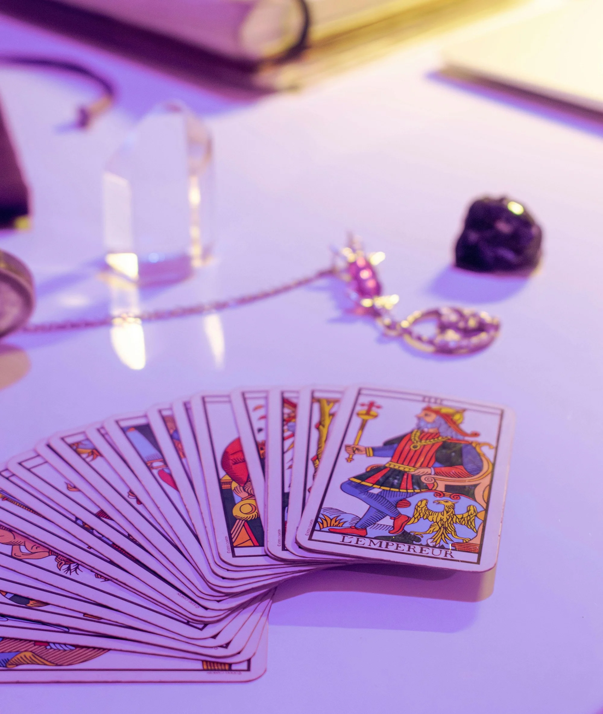 free-photo-of-deck-of-tarot-cards-and-a-transparent-crystal-on-a-table.jpeg