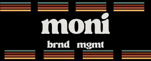 The image shows a black background with the word 'moni' in large white lowercase letters, and below it 'brnd mgmt' in smaller white lowercase letters. There are colorful horizontal lines above and below the text.