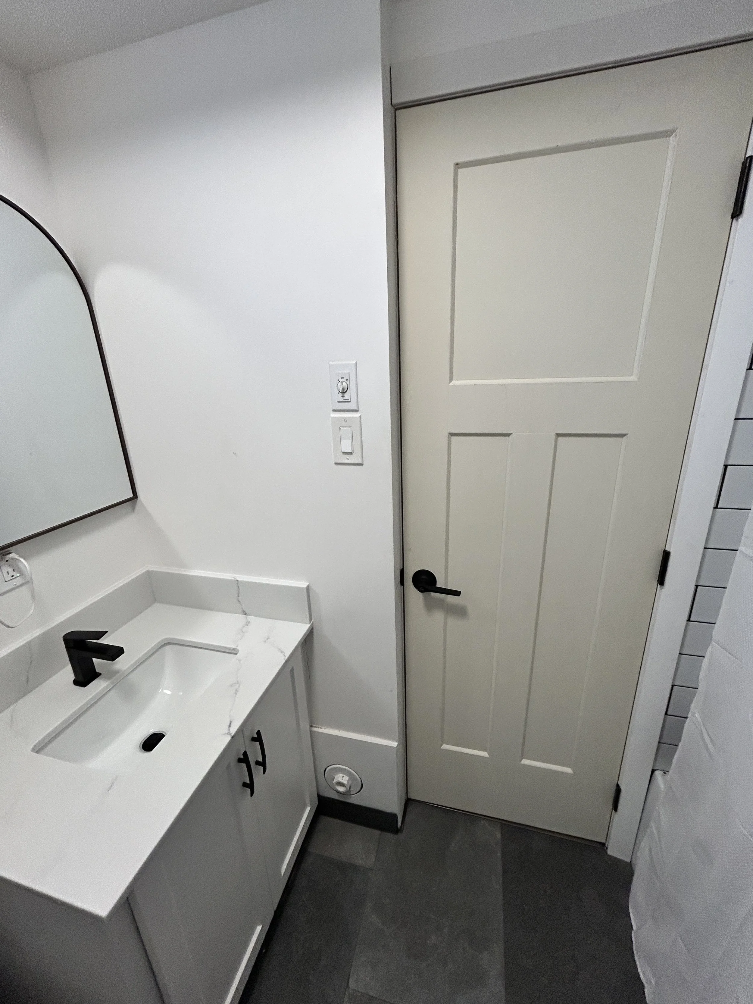 New door and vanity fixed with new countertops.