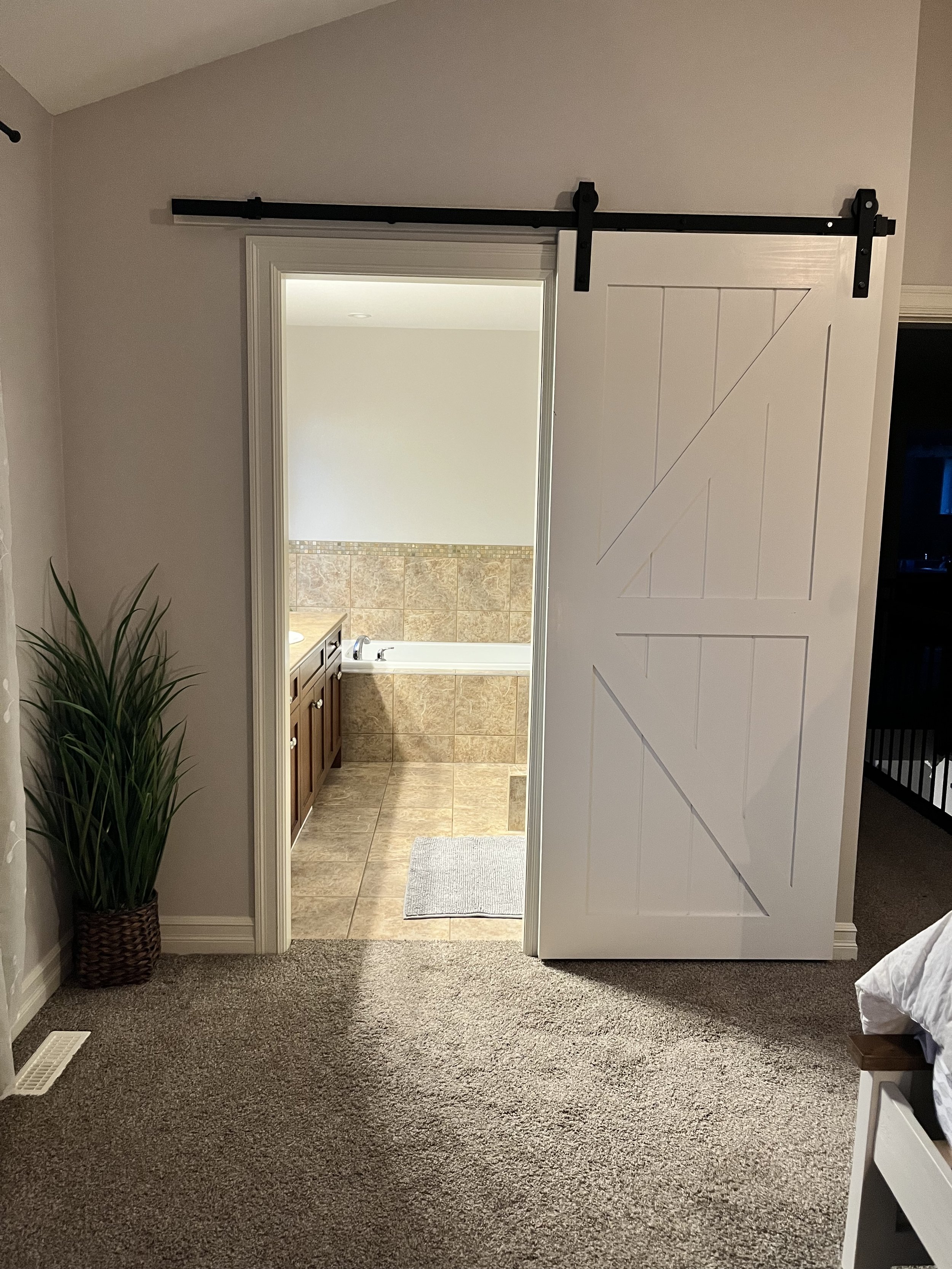 Sliding barn door installed for master bath. 