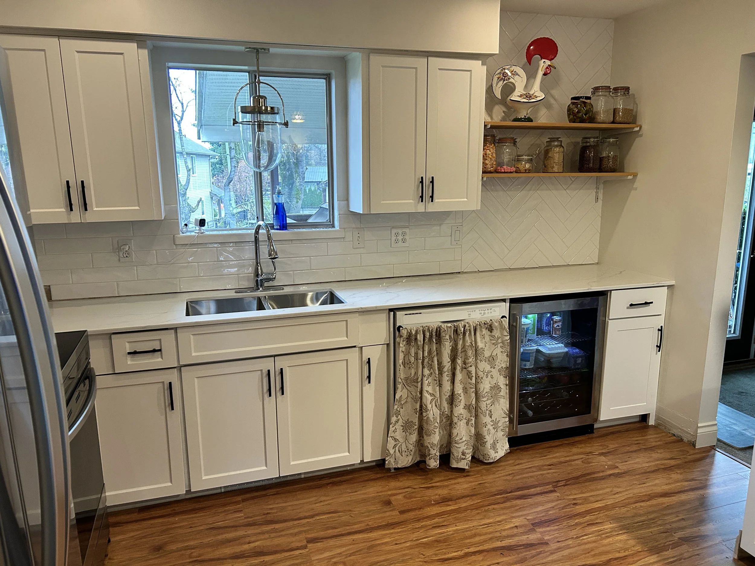 Kitchen cabinets repaired for new countertops.