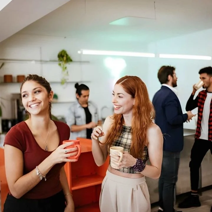 Guests enjoying fresh coffee drinks served by mobile barista at social gathering.
