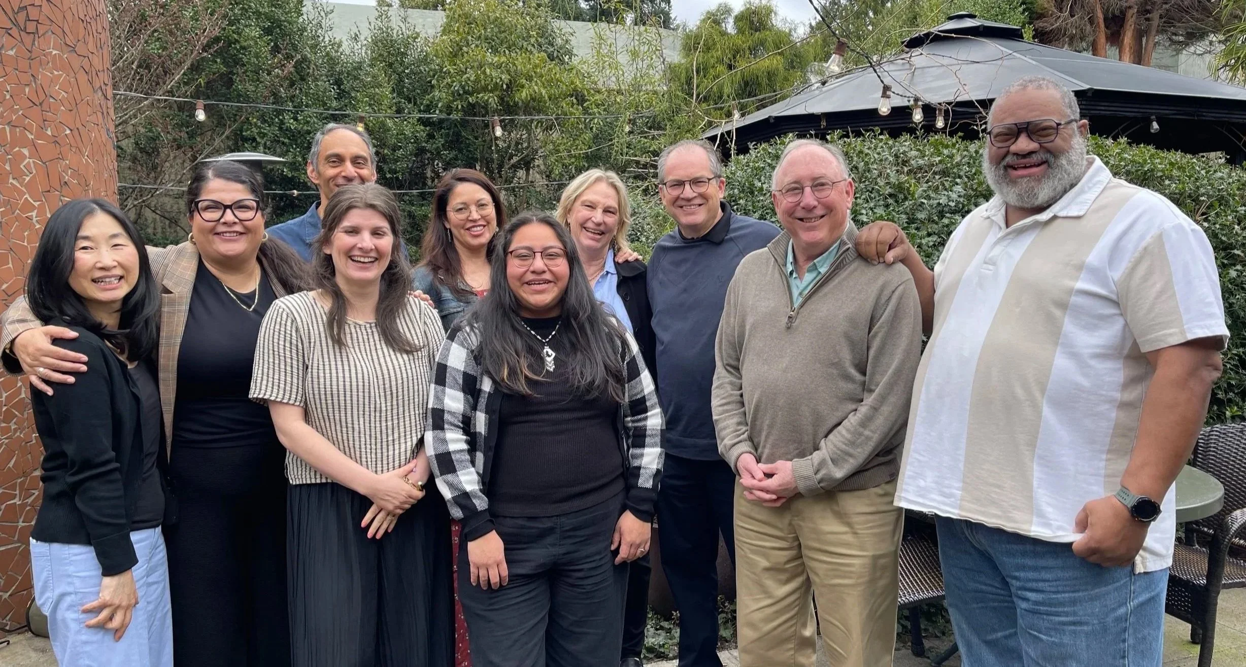 Dahnesh and nine CareOregon Foundation board members pose together