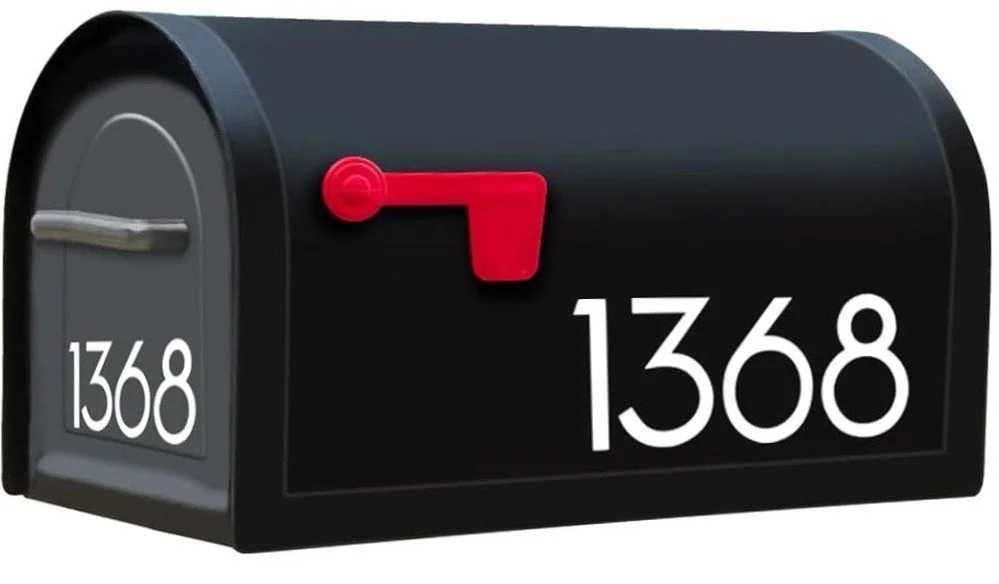 Black novelty mailbox with a red flag, displaying the numbers 1368 on the front and side.