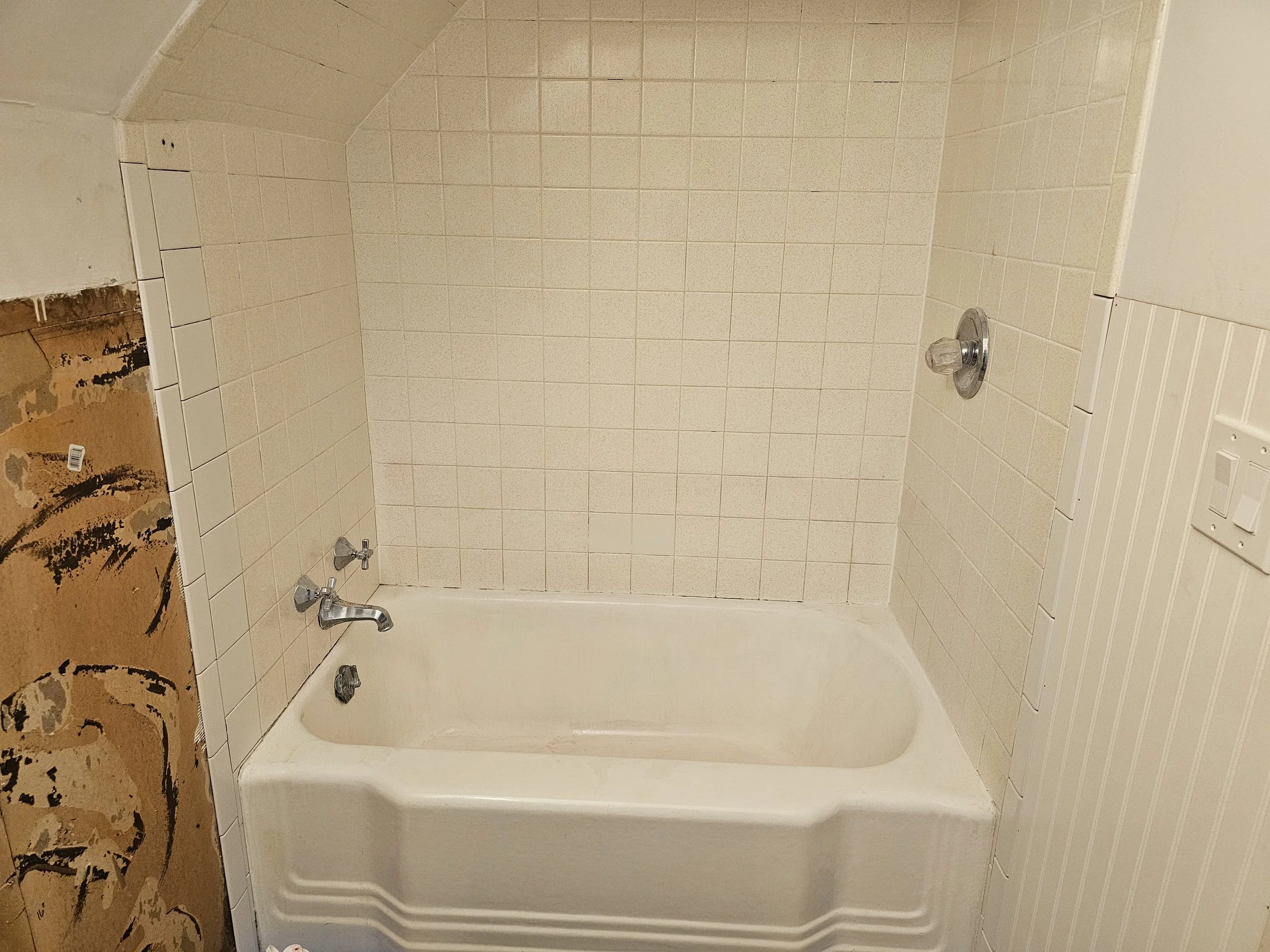 Bathtub and tile refinished in white with slip resistant bottom. Had to regrout after the fact.