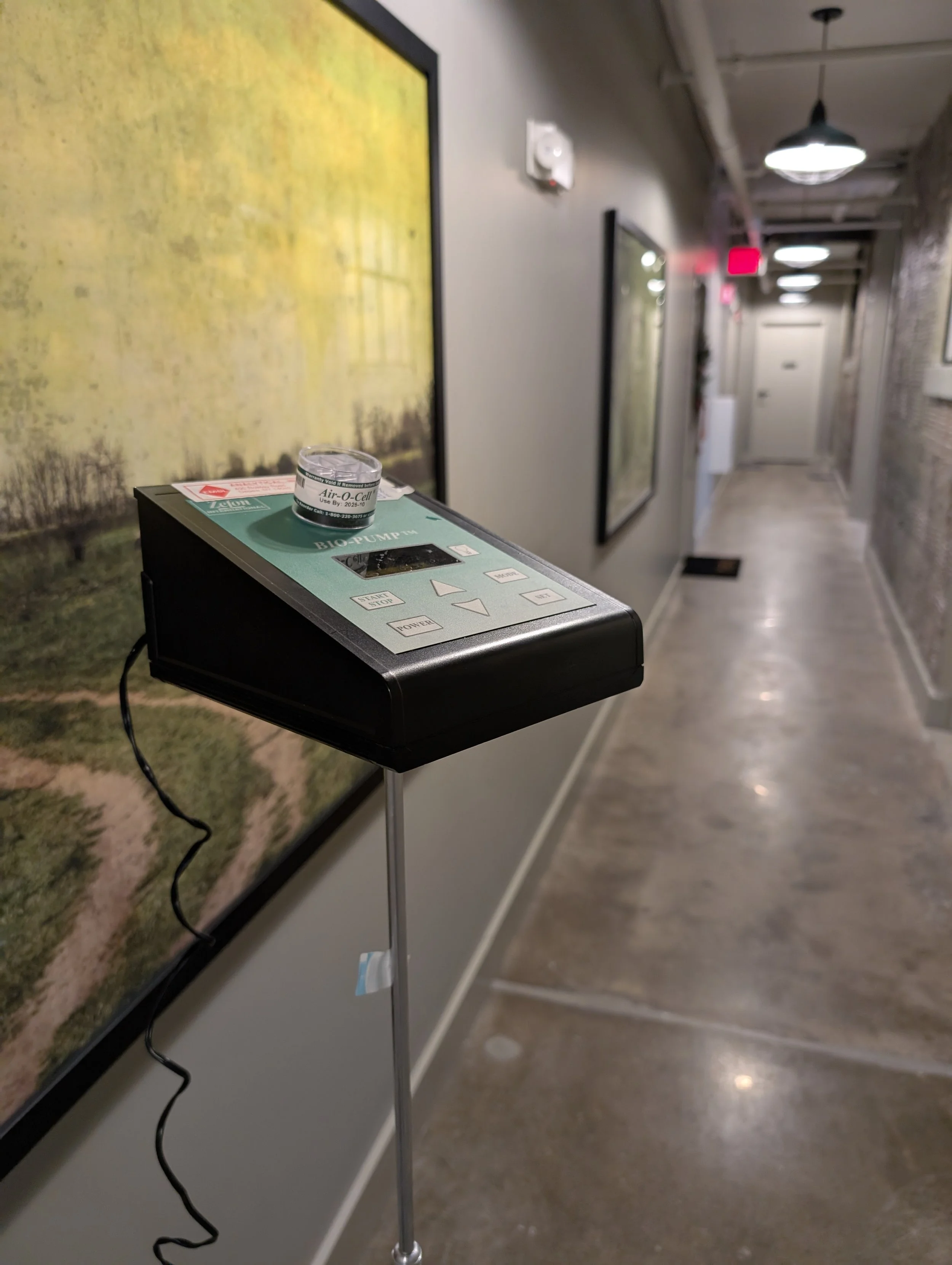 Taking an air sample for a mold test, mold assessment, mold report.