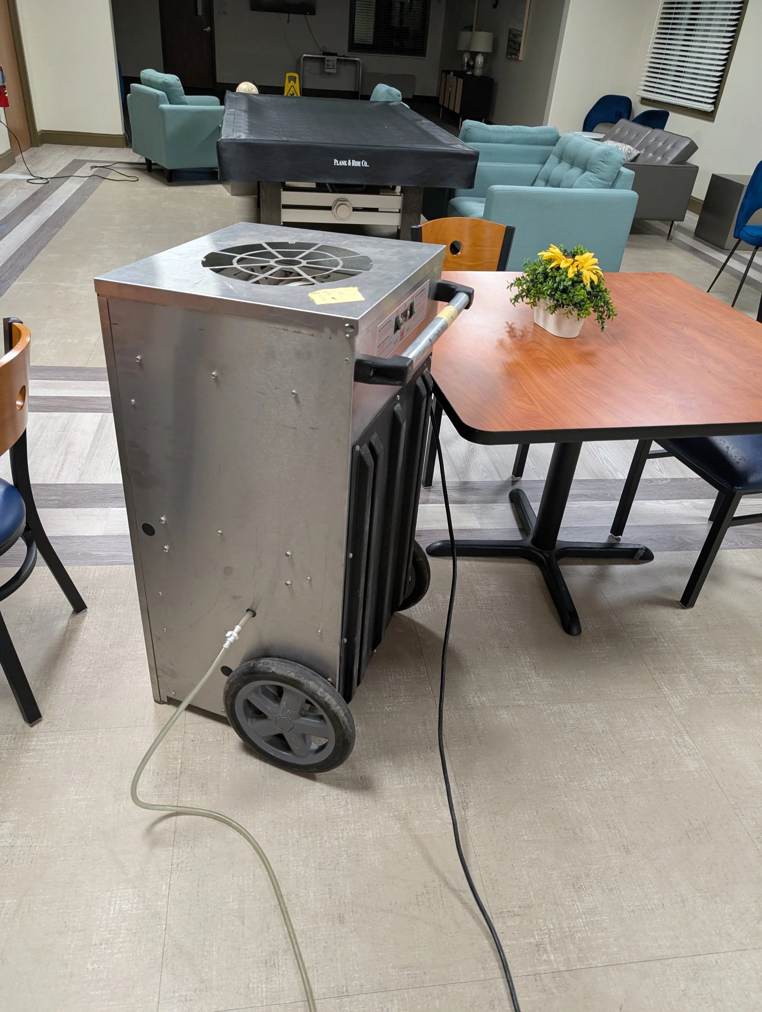 Using dehumidifiers and air movers to dry an entire room. Water cleanup.