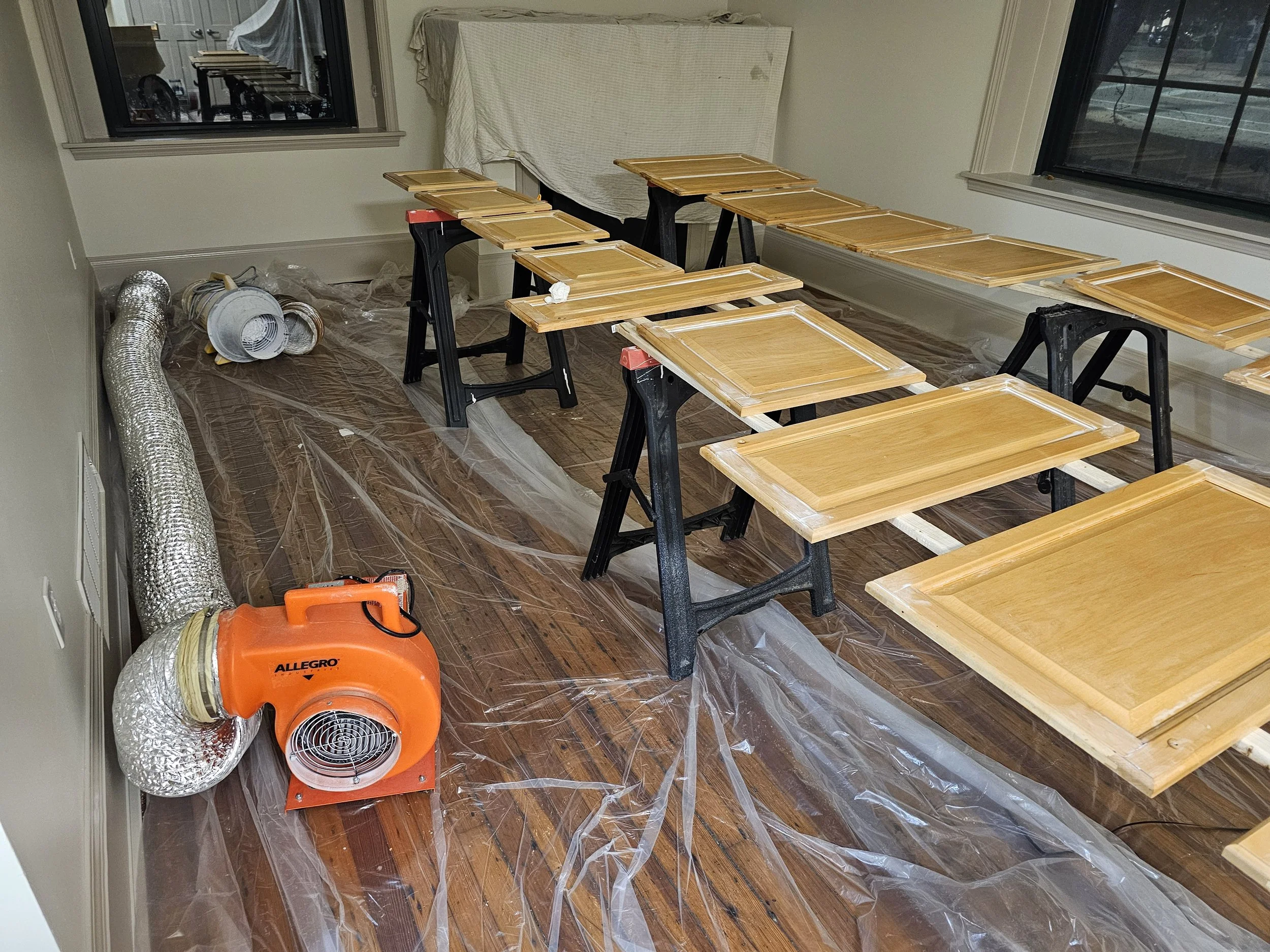 We remove the doors, hardware, and handles. Everything gets refinished separately. Cabinet refinishing.