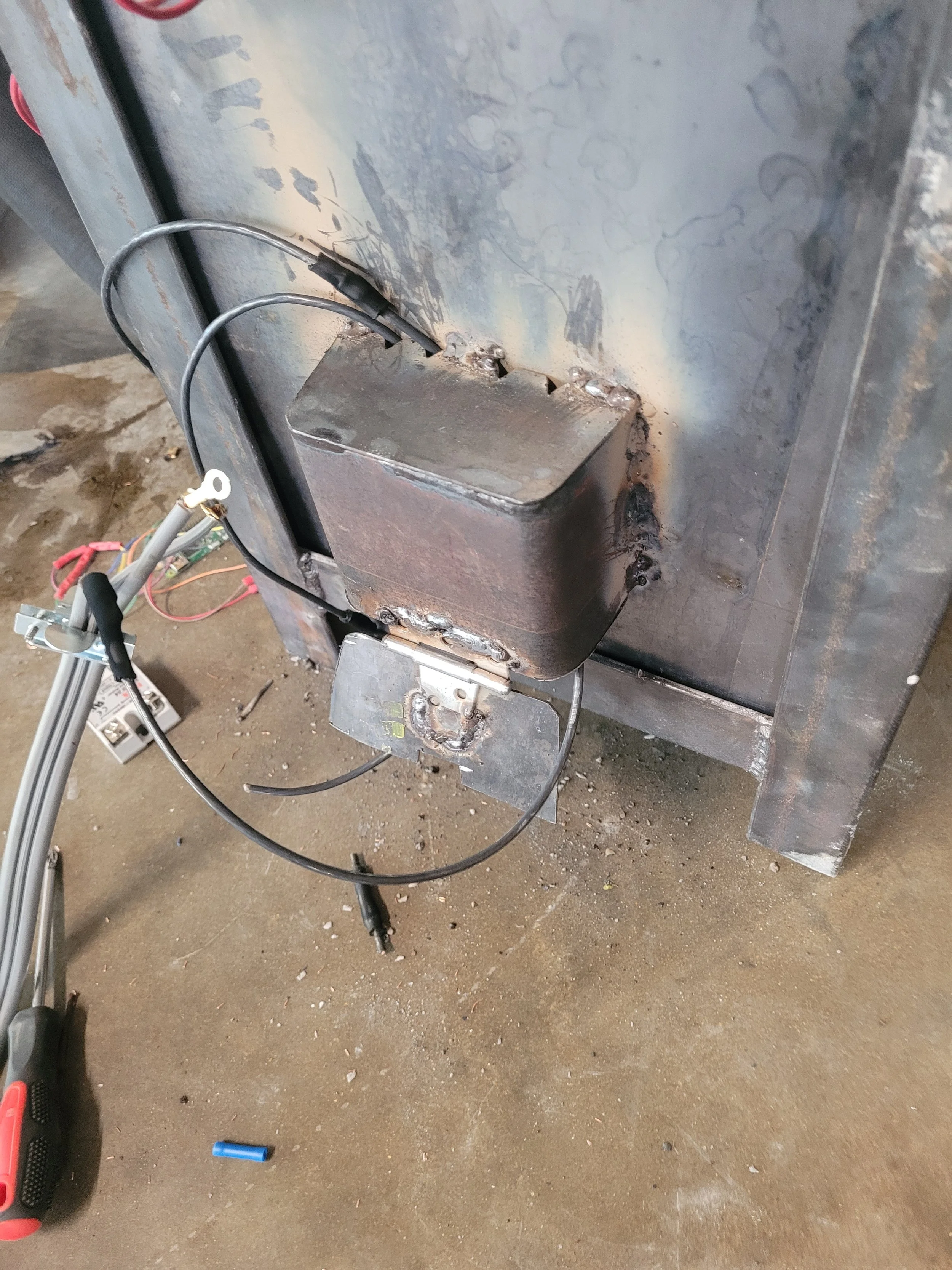 Electronics box mounted to backside