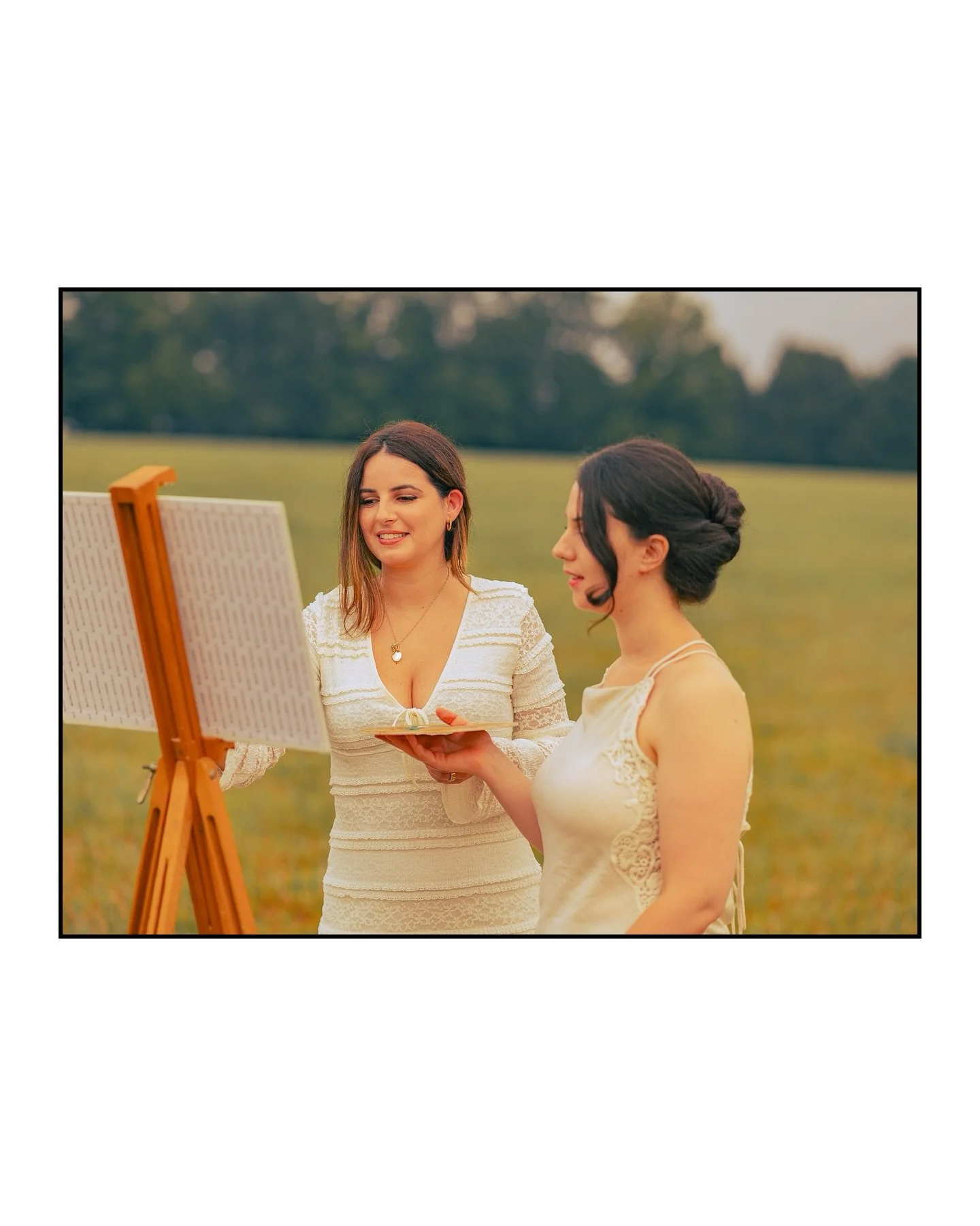 Morning hums in tender hue,
Two souls paint the earth anew;
Brush and laughter, soft, align&mdash;
Heritage and friendship entwine.

Nature blooms beneath their art,
One bright pulse, two beating hearts.