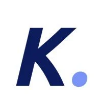 A large blue letter 'K' with a smaller light blue dot next to it on a white background.