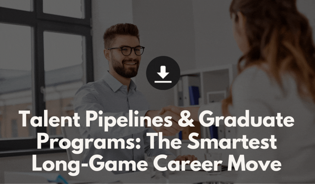 A man with glasses and a beard is shaking hands with a woman in an office setting, smiling.