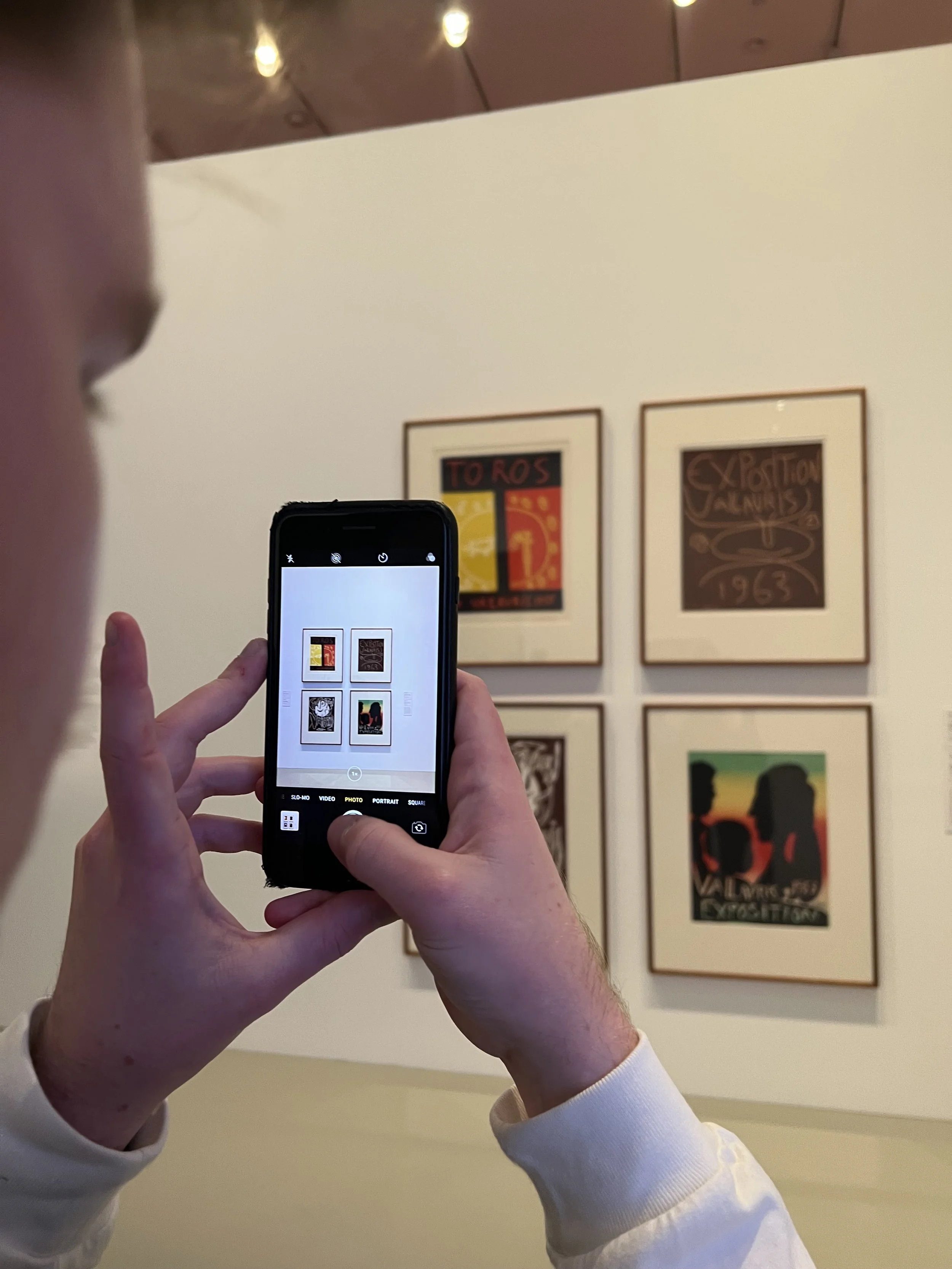 Capturing framed artworks in a minimalist gallery, representing By T's focus on perception, creative direction, and luxury visual storytelling in PR and branding.