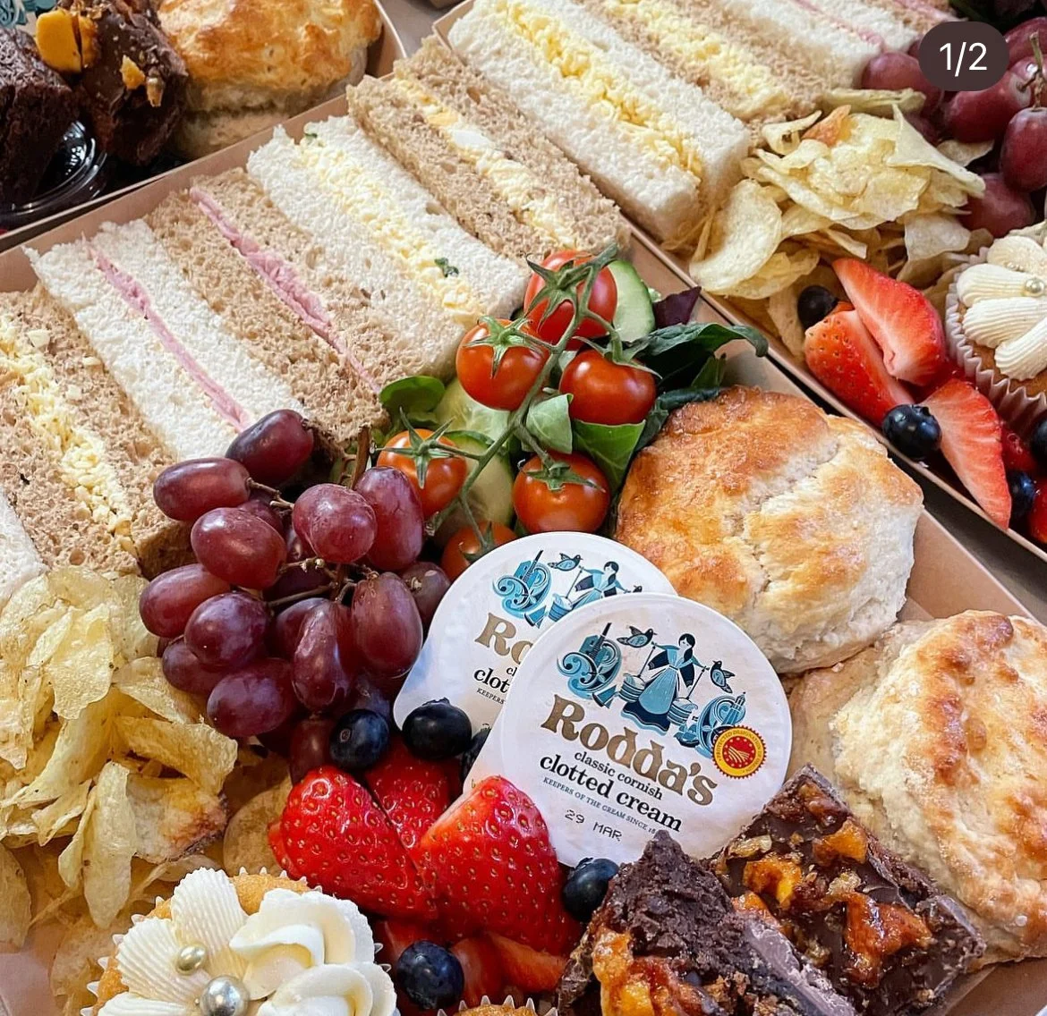 Afternoon Tea for Mothers Day at Allerford Tea Room & Gardens, near Minehead, Somerset, Exmoor. Features scones, clotted cream and jam, fresh fruit and salad, and freshly baked treats and cakes with finger sandwiches