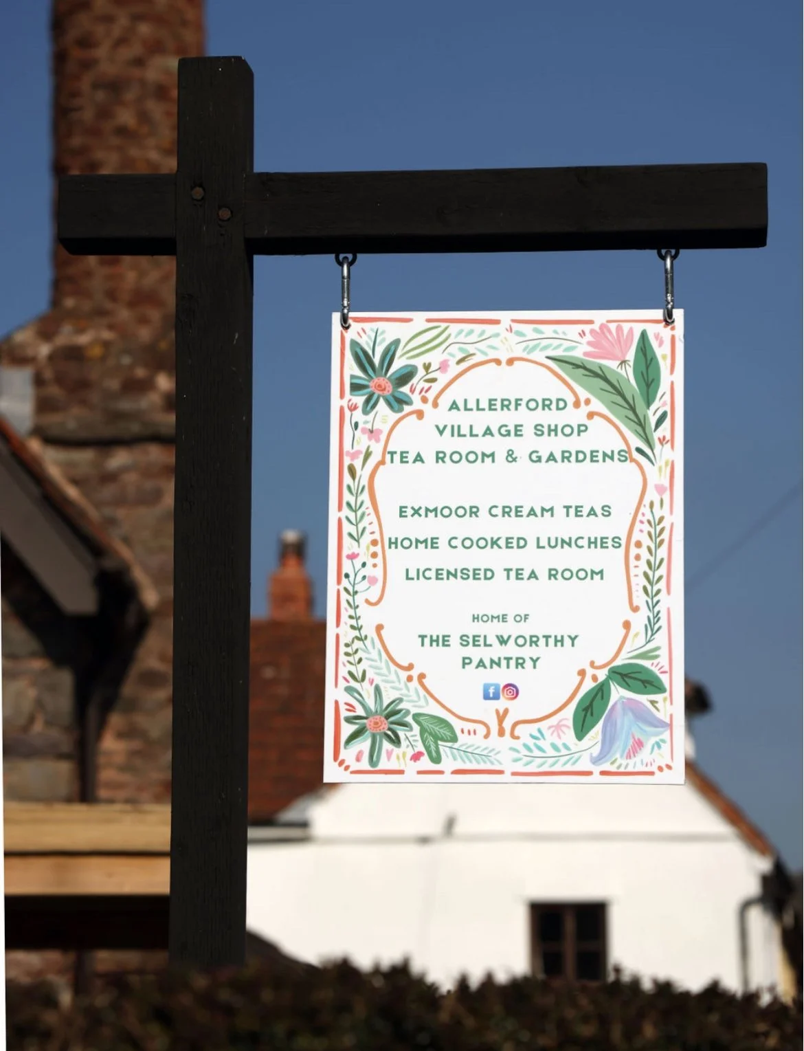 Village sign posting Allerford Tea Room, near Minehead, Exmoor. Sign states that Exmoor Cream Teas, Light Lunches and licensed to sell alcohol. Home of The Selworthy Pantry.