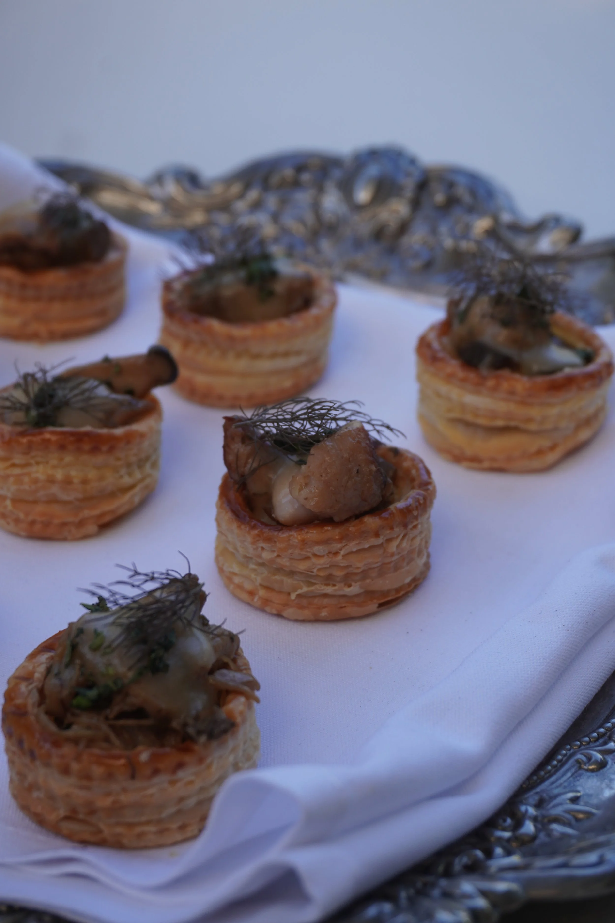 Small finger food on a platter for a dinner party.