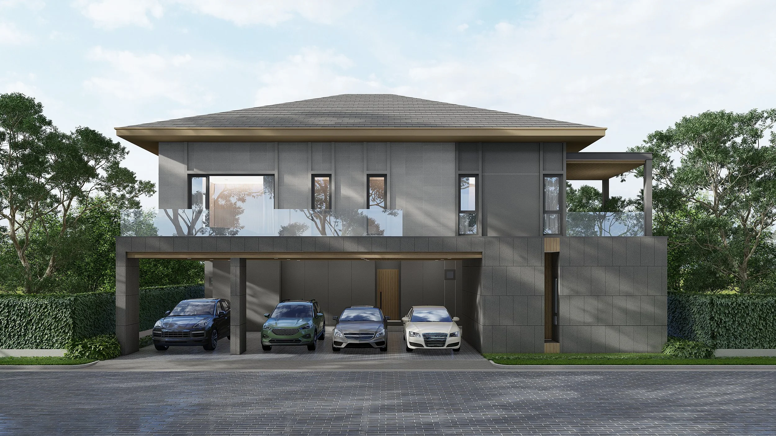 Modern two-story house with gray exterior, glass balcony, and four parked cars in front, surrounded by trees and a hedge.