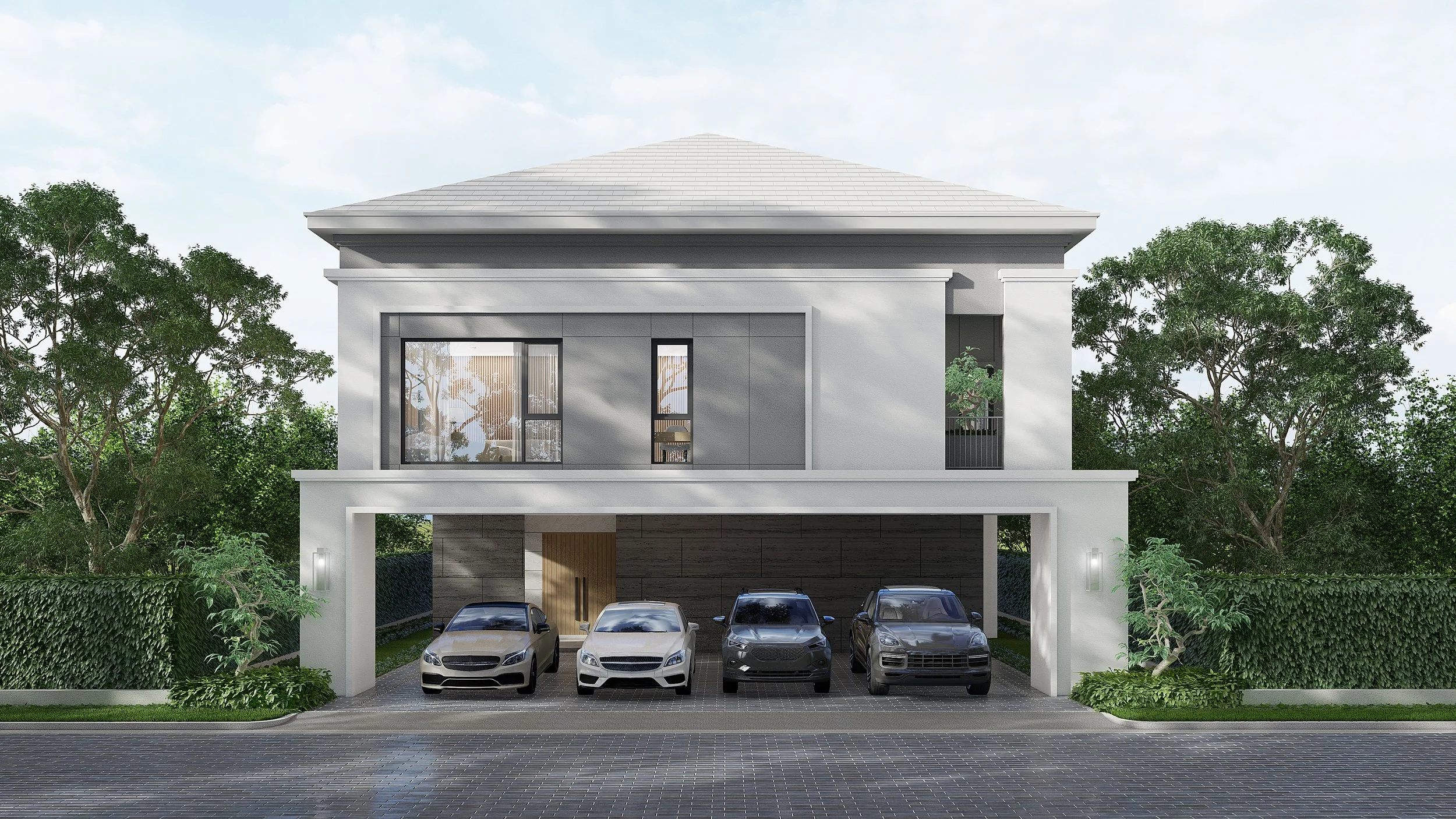 Front view of a modern two-story house with four parked cars underneath, surrounded by trees and a hedge, on a paved driveway.