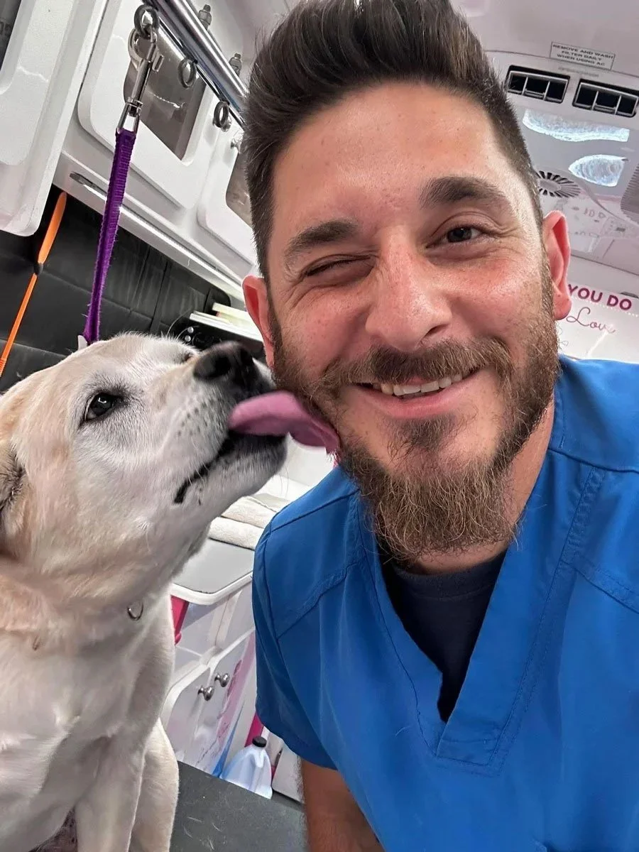 dog licking mobile bather