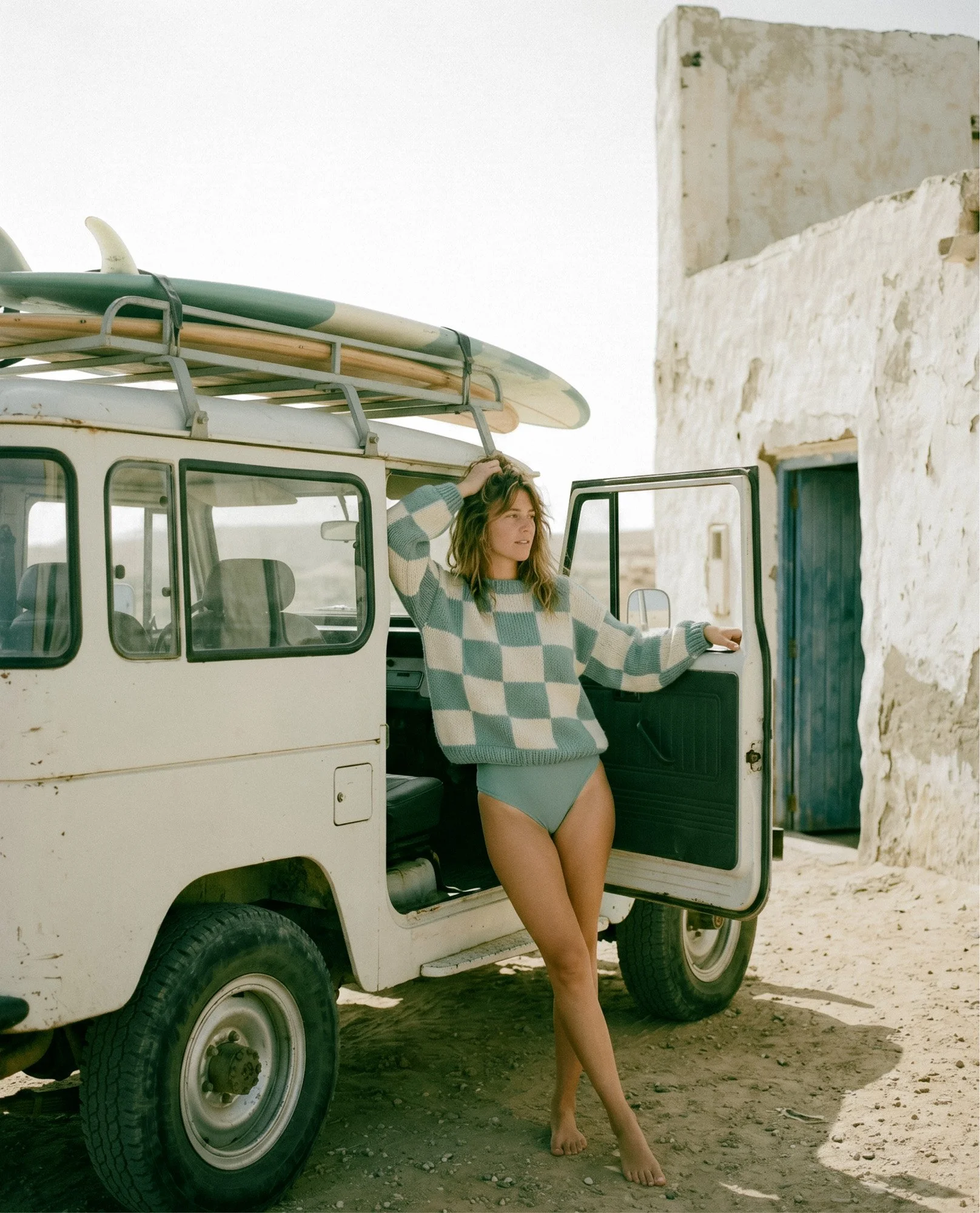 Vintage film lifestyle shot of woman with Land Rover — brand photography direction for South Coast Swimwear, Byron Bay