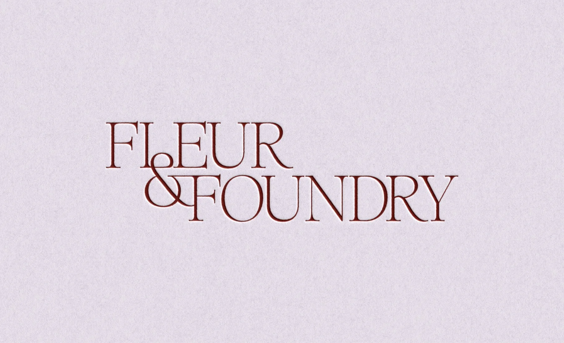 Fleur & Foundry wordmark logo embossed on a soft lavender background.