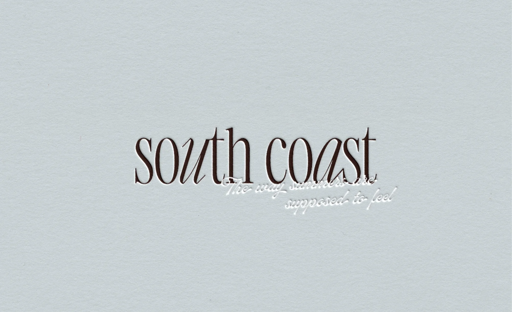 Debossed logo design for South Coast Swimwear — luxury swimwear brand identity by The Kinn Co