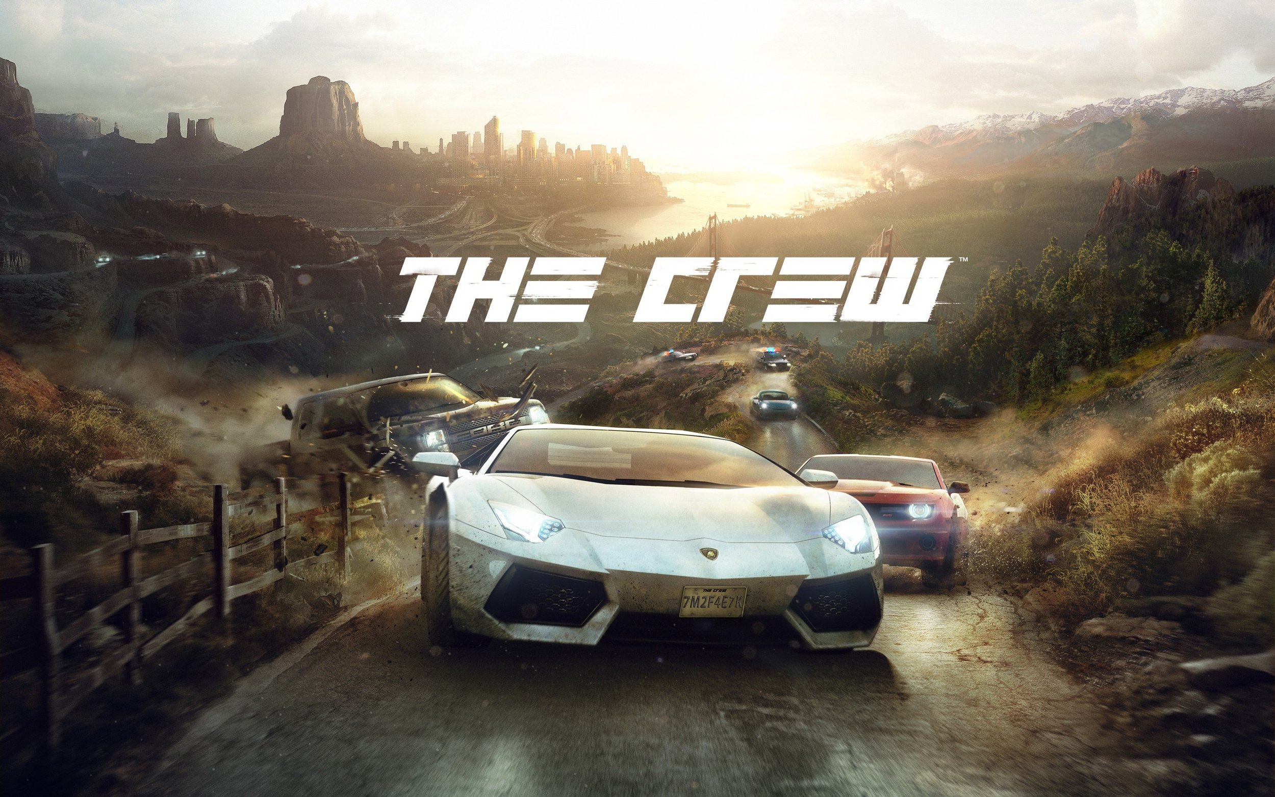 A high-speed race with luxury sports cars, including a Lamborghini, driving on a winding mountain road during sunset with a city skyline, mountains, and a river in the background.