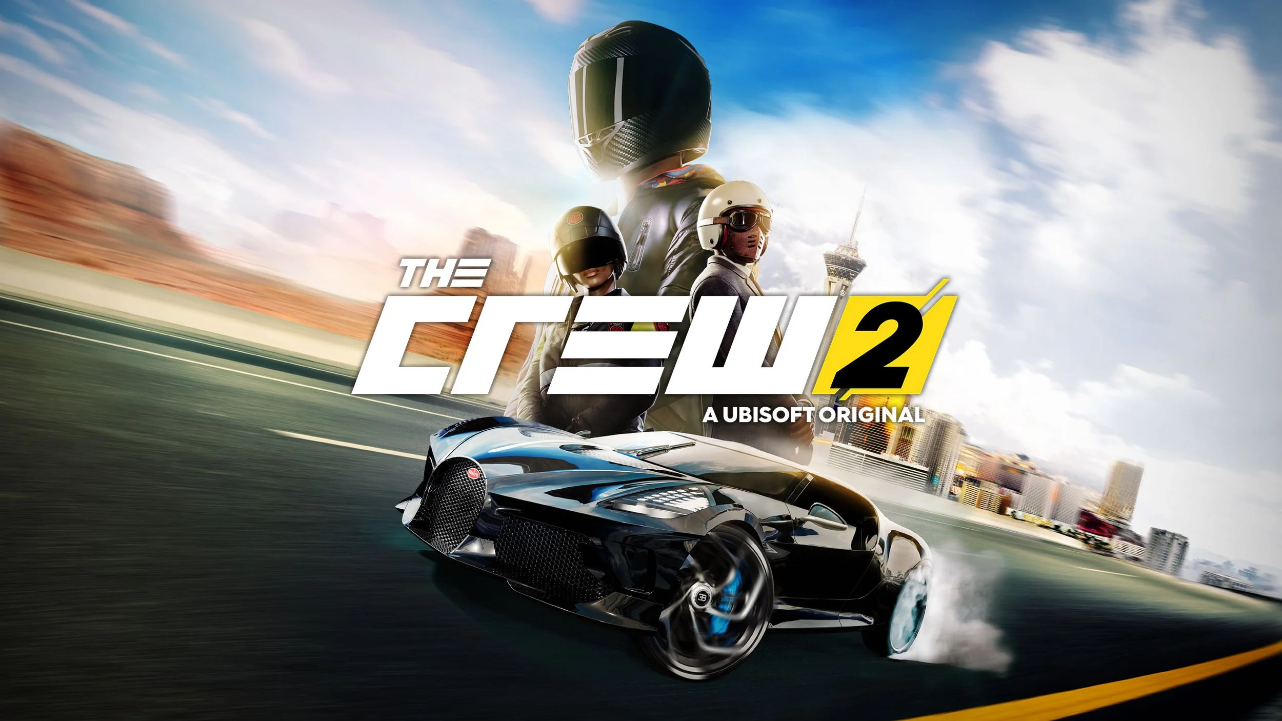 Artwork for the video game 'The Crew 2' showing a racing car on a city street with three racers in helmets and gear standing behind it, in front of a city skyline with a tower in the distance.