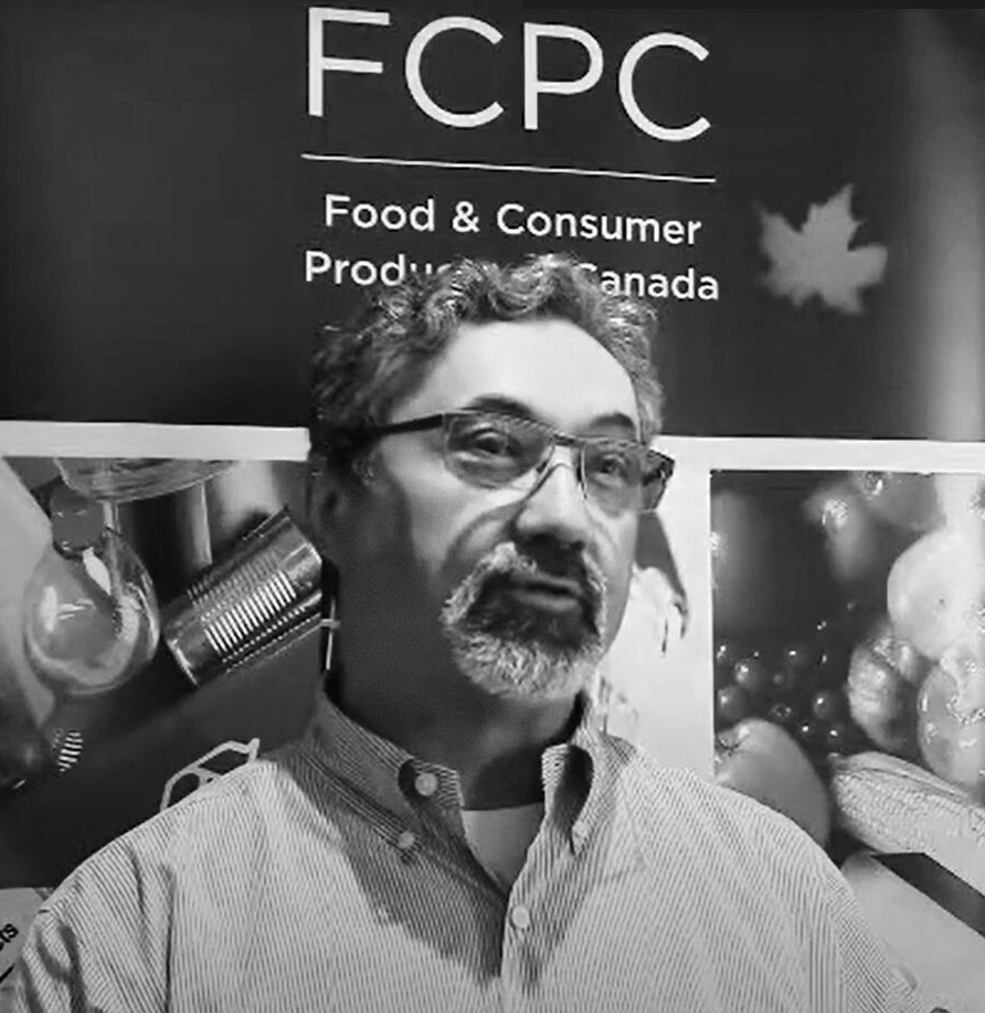 Photo of Arthur (Art) Horn speaking at an event, representing his experience leading a long-standing company and sharing insights on business leadership and organizational growth.