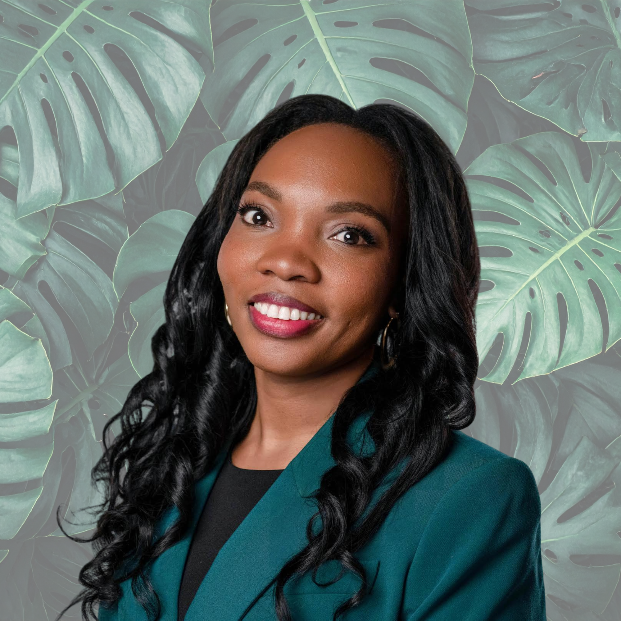 A professional woman with long black hair and earrings, smiling, wearing teal blazer and black top, against a gray background.