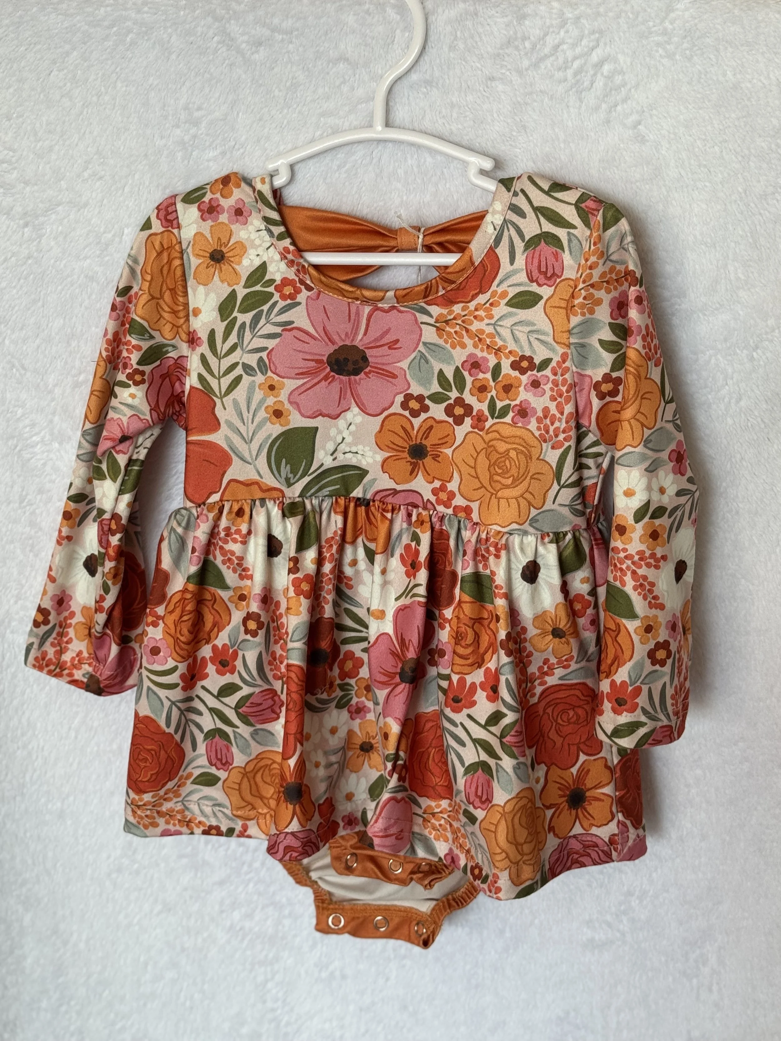 FLOWERED ROMPER SIZE 12-18 MONTHS