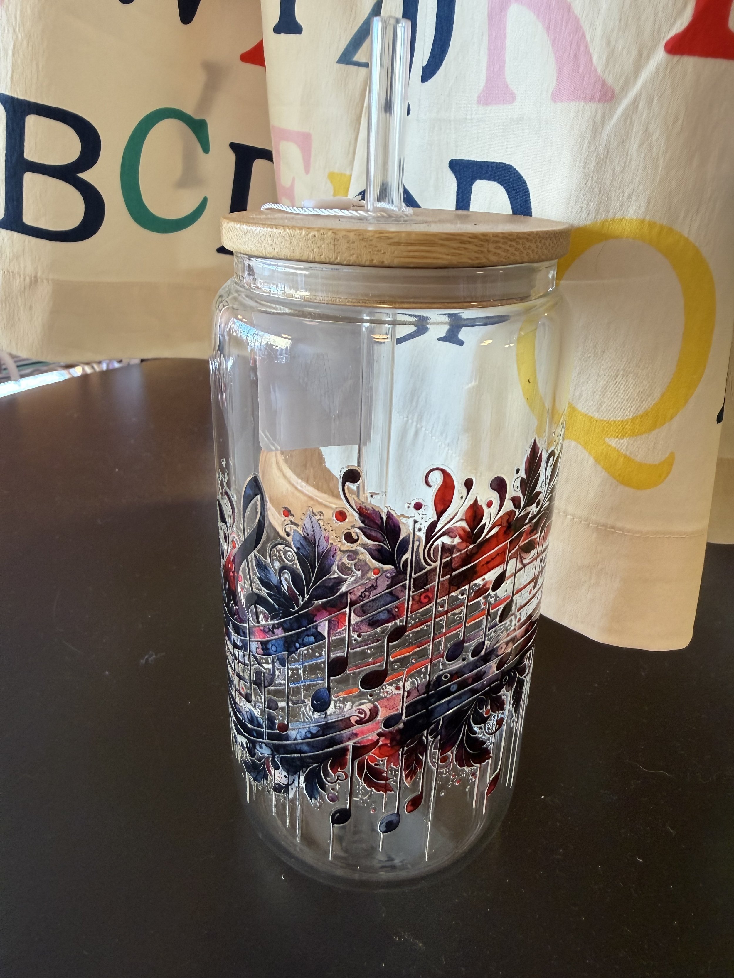 Glass with bamboo lid and straw