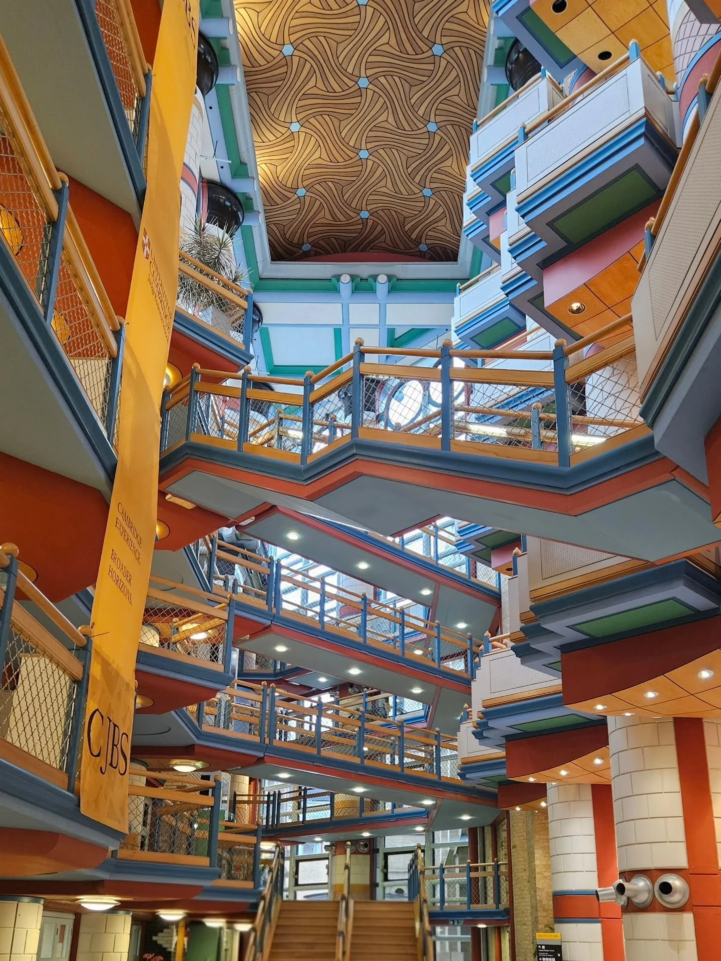 Visited Cambridge Judge Business School, a place I once studied and a building that never stops surprising me. Designed by architect John Outram, the school transforms the old hospital site into a maze of colour, light and geometry. Every walkway, co