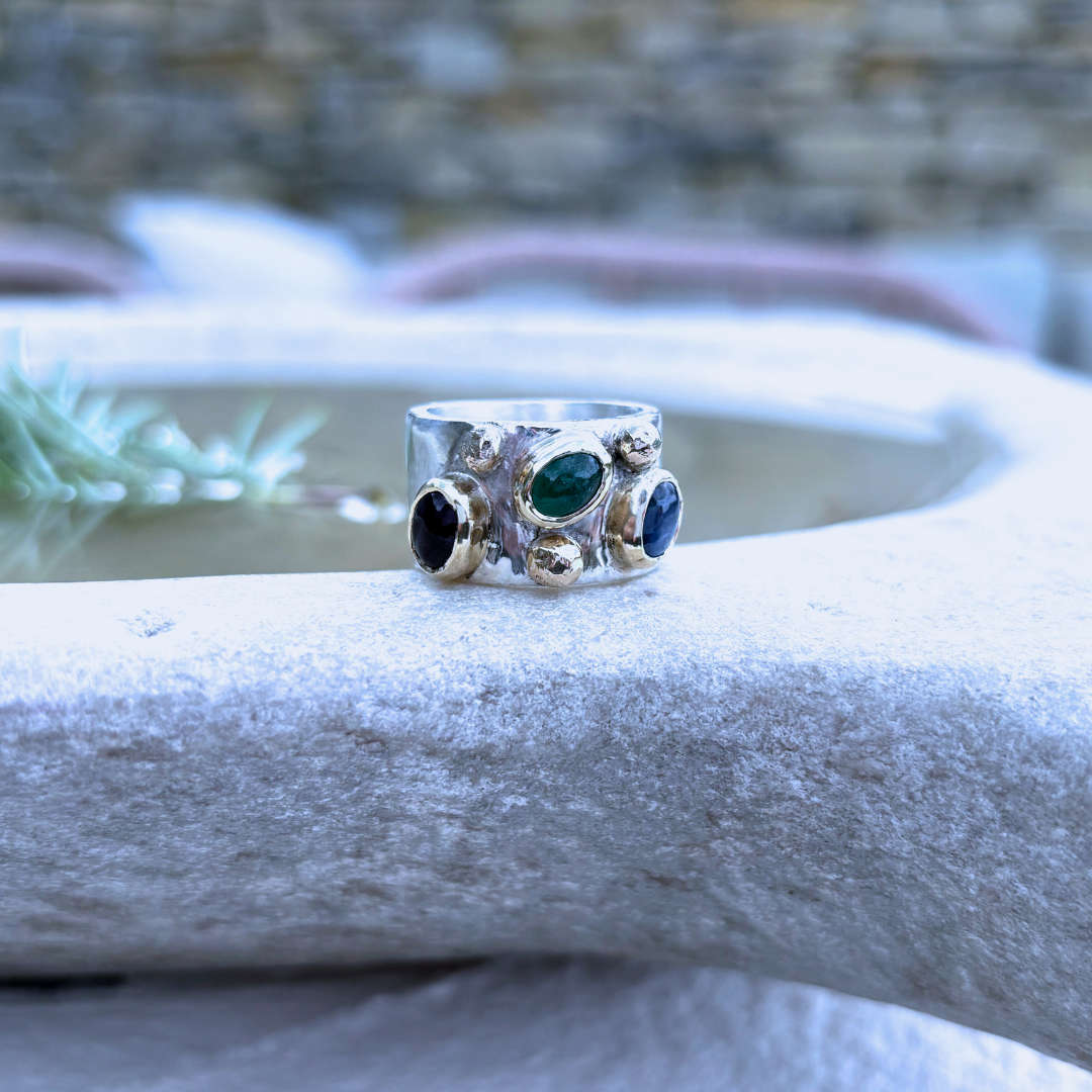 Silver gemstone ring by Madeline Holloway Jewellery, a client of One Voice Marketing, displayed on a textured white surface.