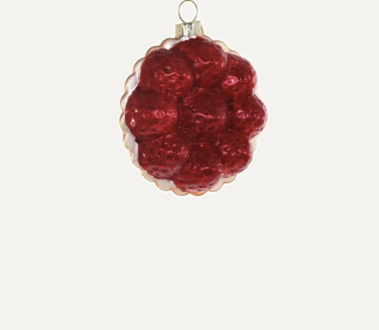 Strawberry-shaped Christmas ornament with a metallic cap and loop, hanging against a plain background.