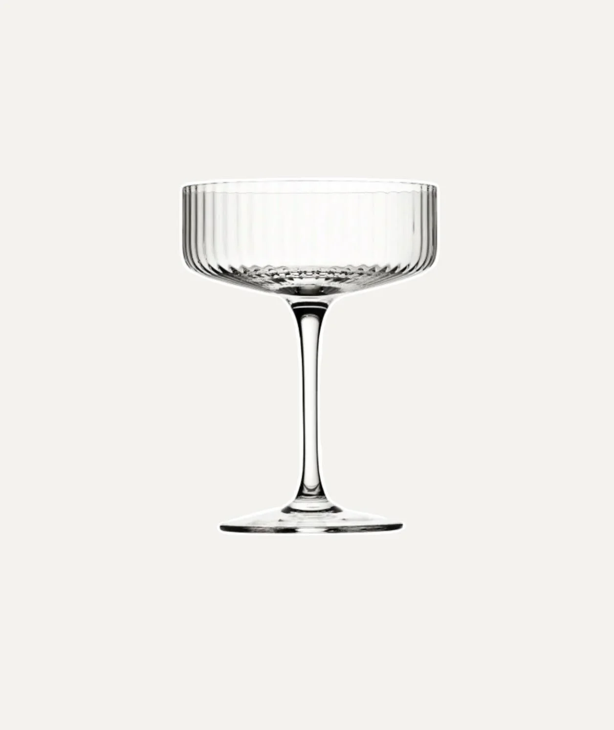 A clear, empty glass coupe with a ribbed bowl on a plain white background.
