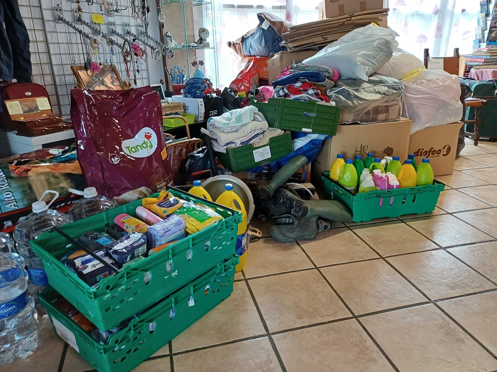 A pile of donated goods for the Paws Xaló shelter, temporarily stored in the charity shop
