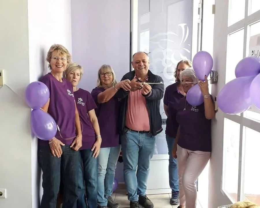 The Mayor of Xaló cutting the tape to open the Paws Xaló Charity Shop