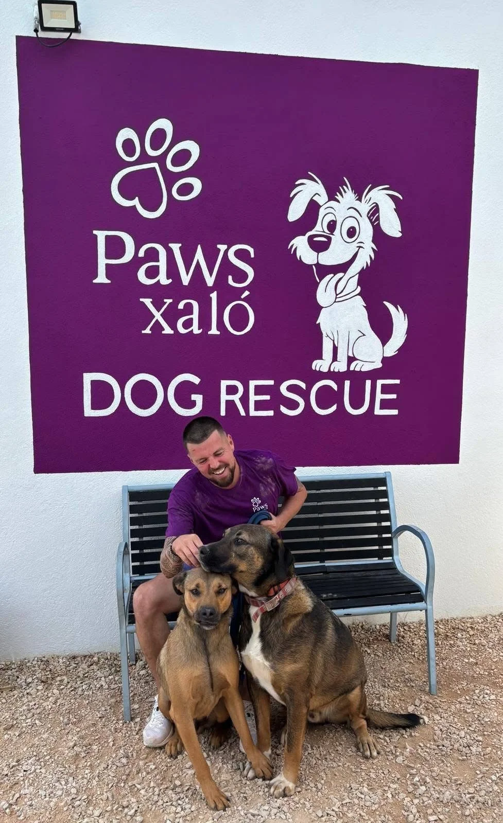 Lee Harker and two dogs, at the Paws Xaló shelter