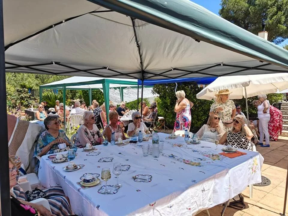 Everyone having a lovely time in the sun at the Paws Xaló afternoon tea event