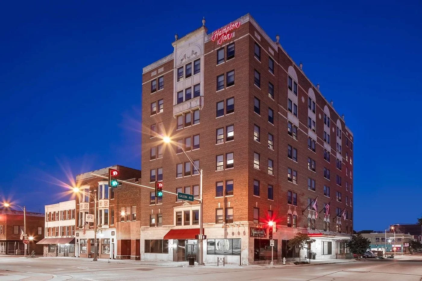 Historic brick Hampton Inn in downtown Freeport at dusk