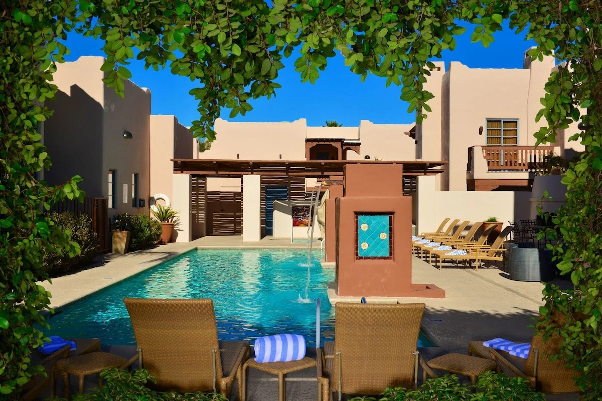 Lodge on the Desert pool courtyard and adobe-style buildings