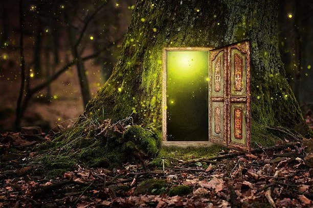 A large tree with a door and window opening, with a glowing green light and floating fireflies in a forest setting.