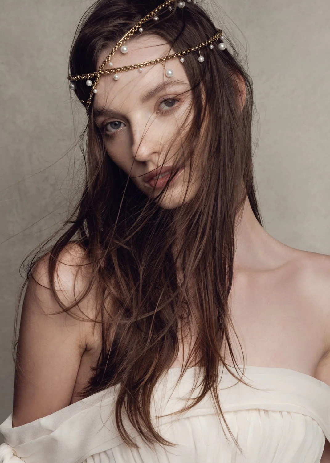 Fashion editorial headshot photographed by Kay Lai Studio in Hong Kong. The subject exudes confidence with elegantly flowy hair, captured in a striking editorial portrait style.