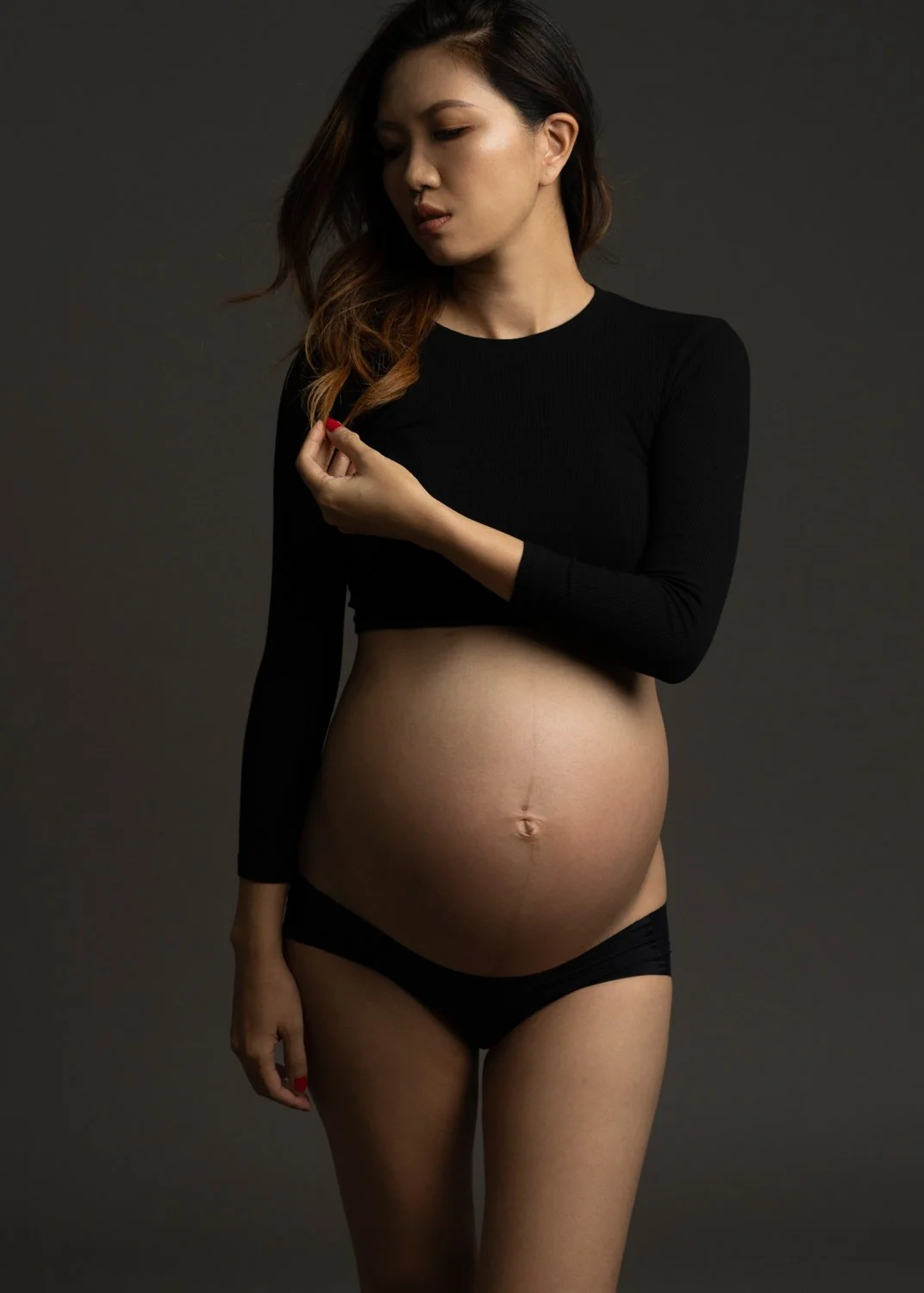 Timeless fashion editorial maternity portrait photographed by Kay Lai Studio in Hong Kong, capturing elegant and sophisticated motherhood moments.