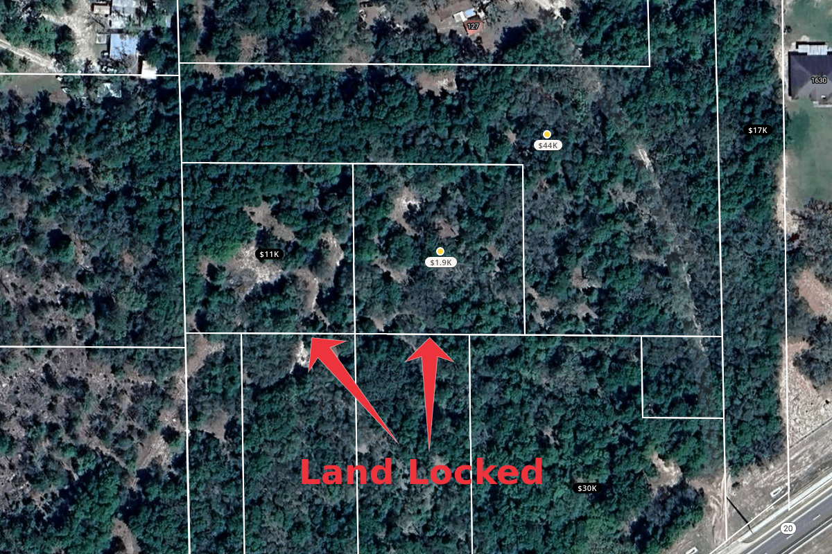 Overhead view of a wooded area with property boundaries marked in white lines. Two parcels are marked as 'Land Locked' with red arrows. The image includes various property sizes and prices, with one area labeled as $11K, another as $44K, and others with different values.