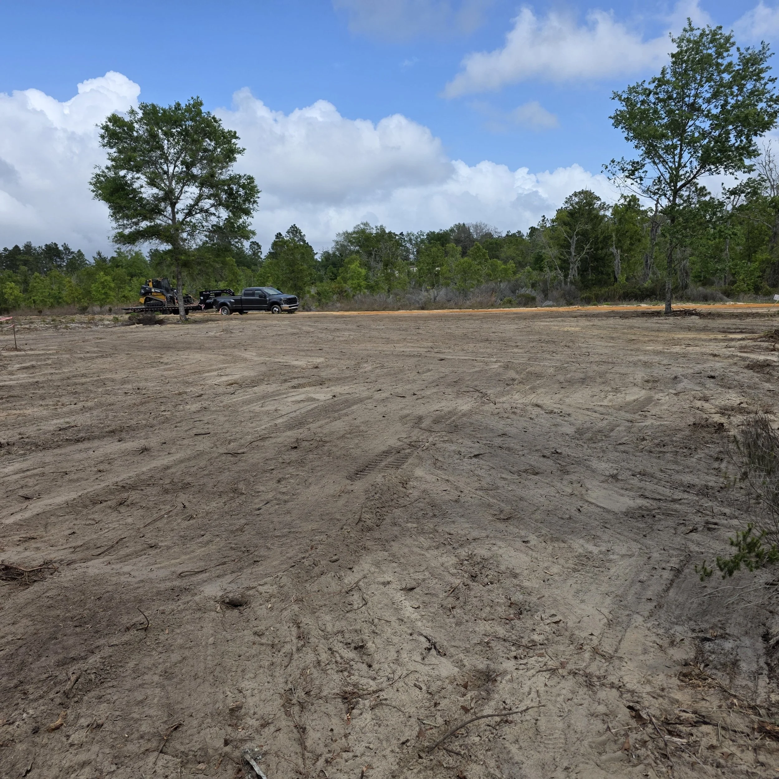 Root-raked and cleared Hawthorne homesite before construction of a 40-by-60-foot house pad
