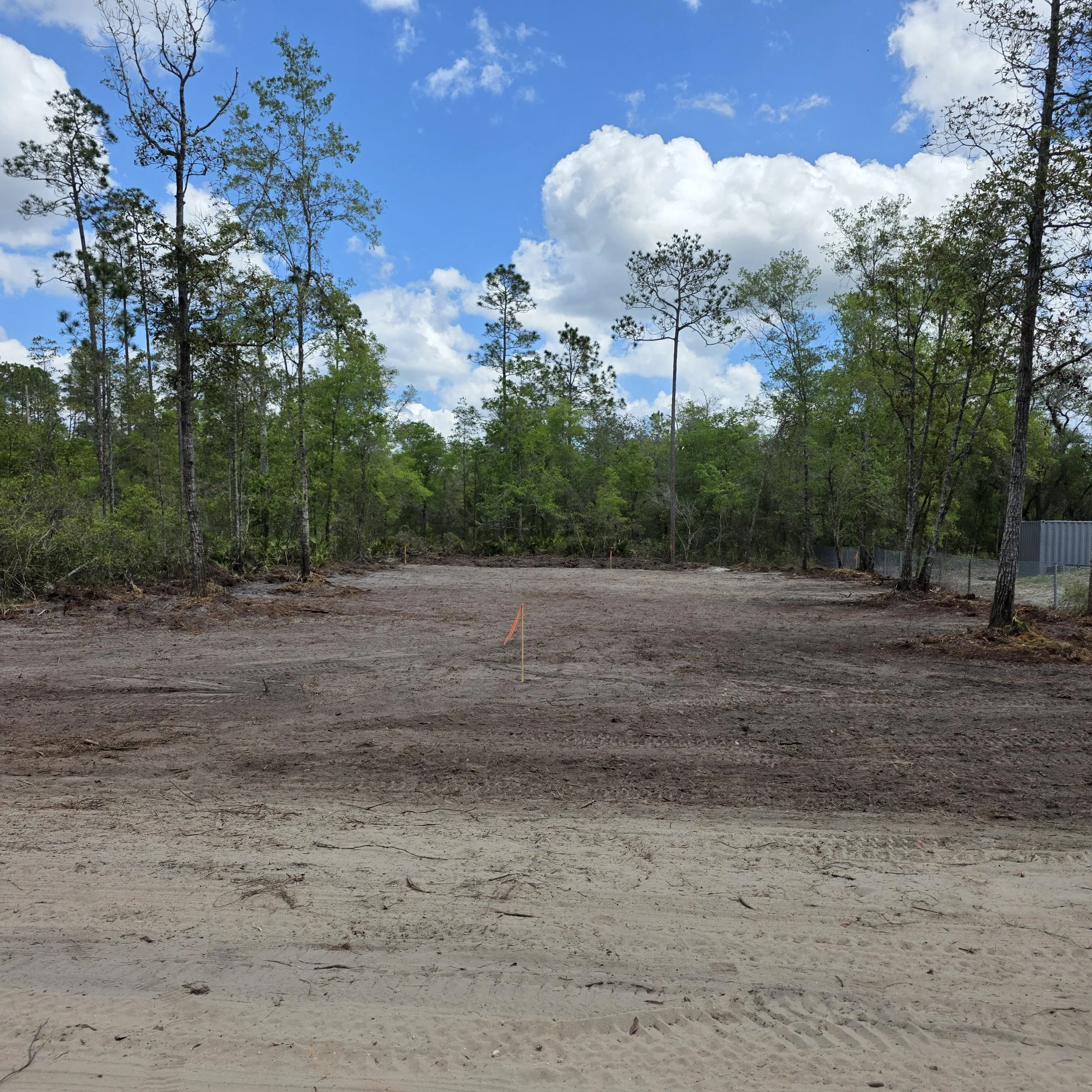 Open and smoothed mobile-home site after root raking in Interlachen, Florida