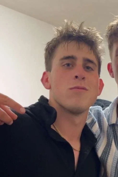 A photo of Cai Dunn with messy hair and wearing a black shirt, to show the user what the owner of Cai Copy looks like