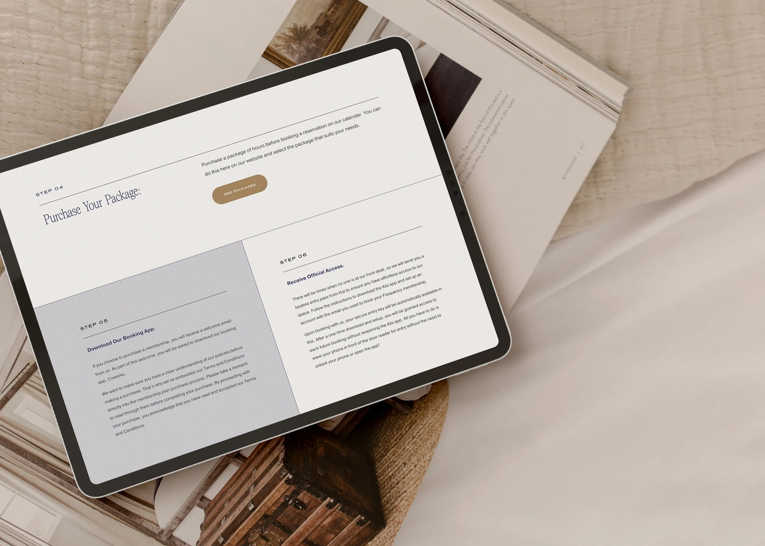 Tablet displaying a step-by-step guide for purchasing a package, with sections labeled 'Download Our Booking App' and 'Receive Official Access', resting on an open magazine or catalog on a light-colored surface.